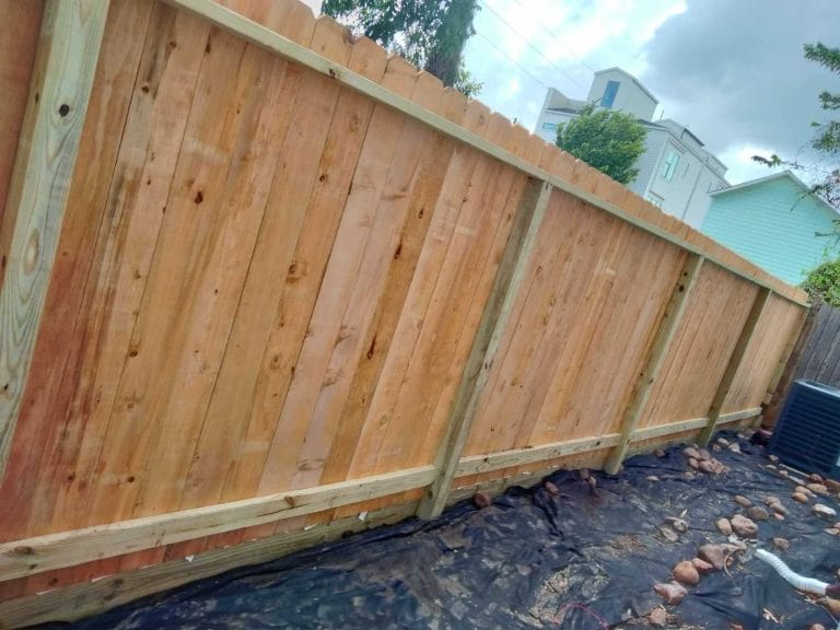New wood privacy fence photographed along its length