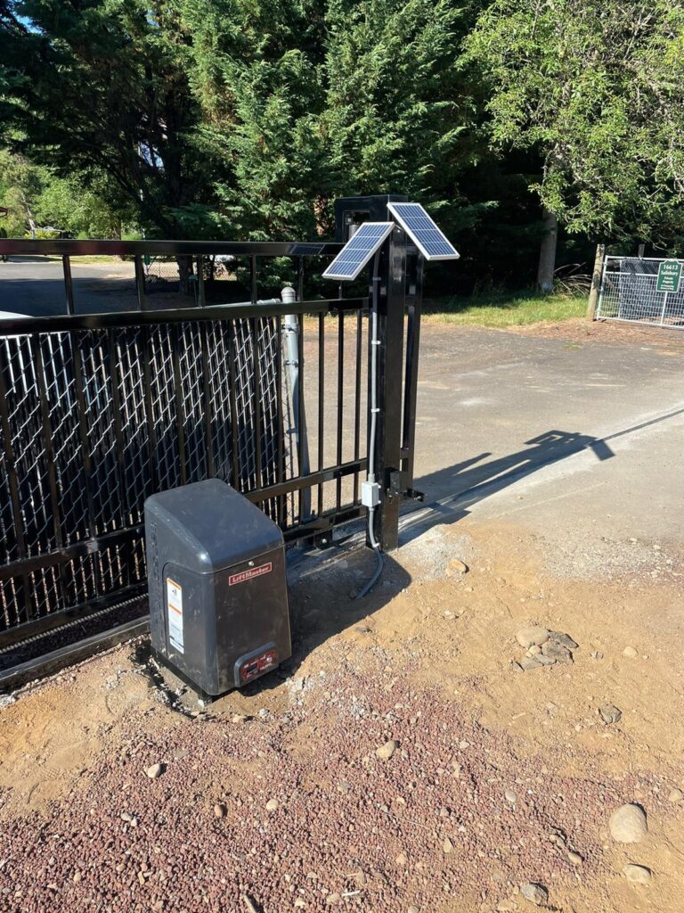 Automatic gate opener mechanism on a residential driveway gate