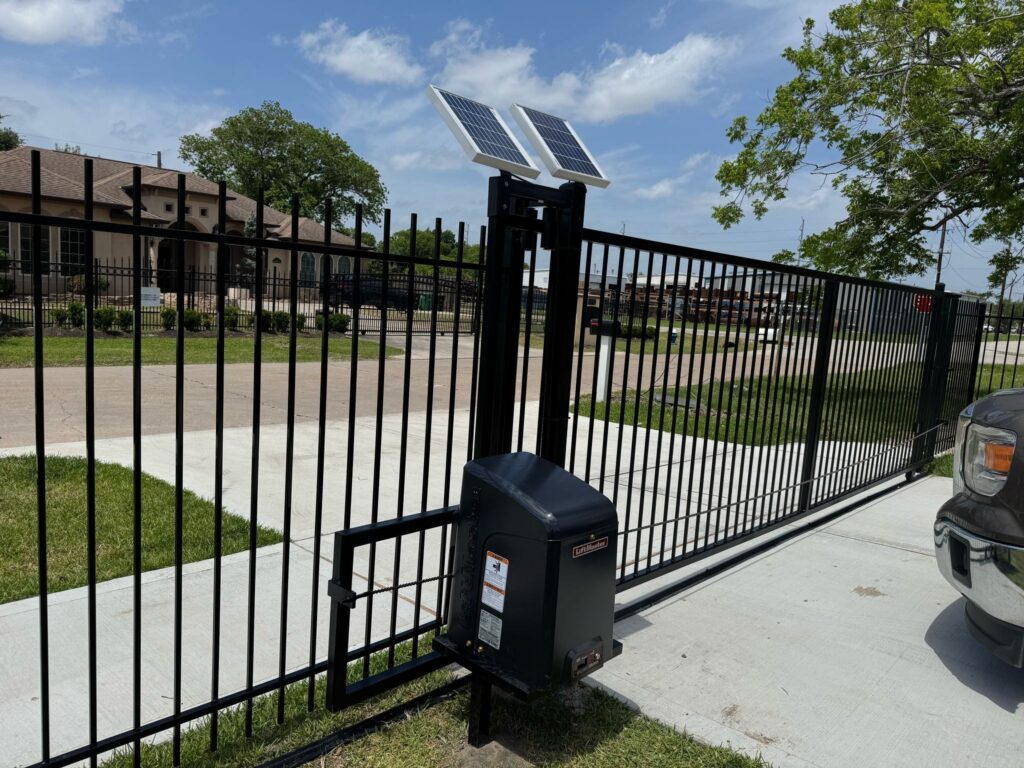 Iron driveway gate with automatic operator at a residential property
