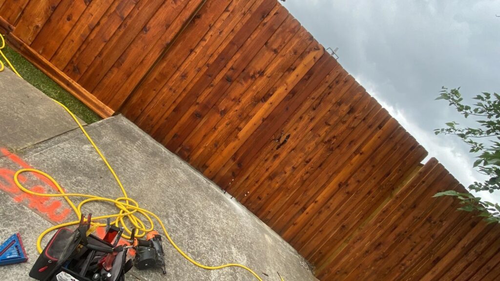 Cedar wood fence installation with sealing tools