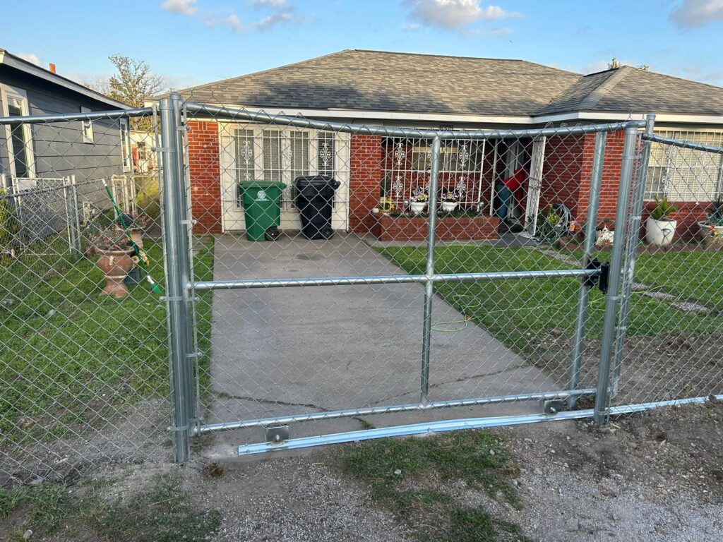 Chain link double drive gate at a residential property