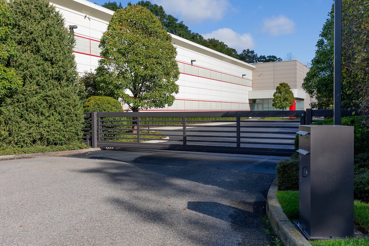 Modern automatic sliding gate at a commercial facility