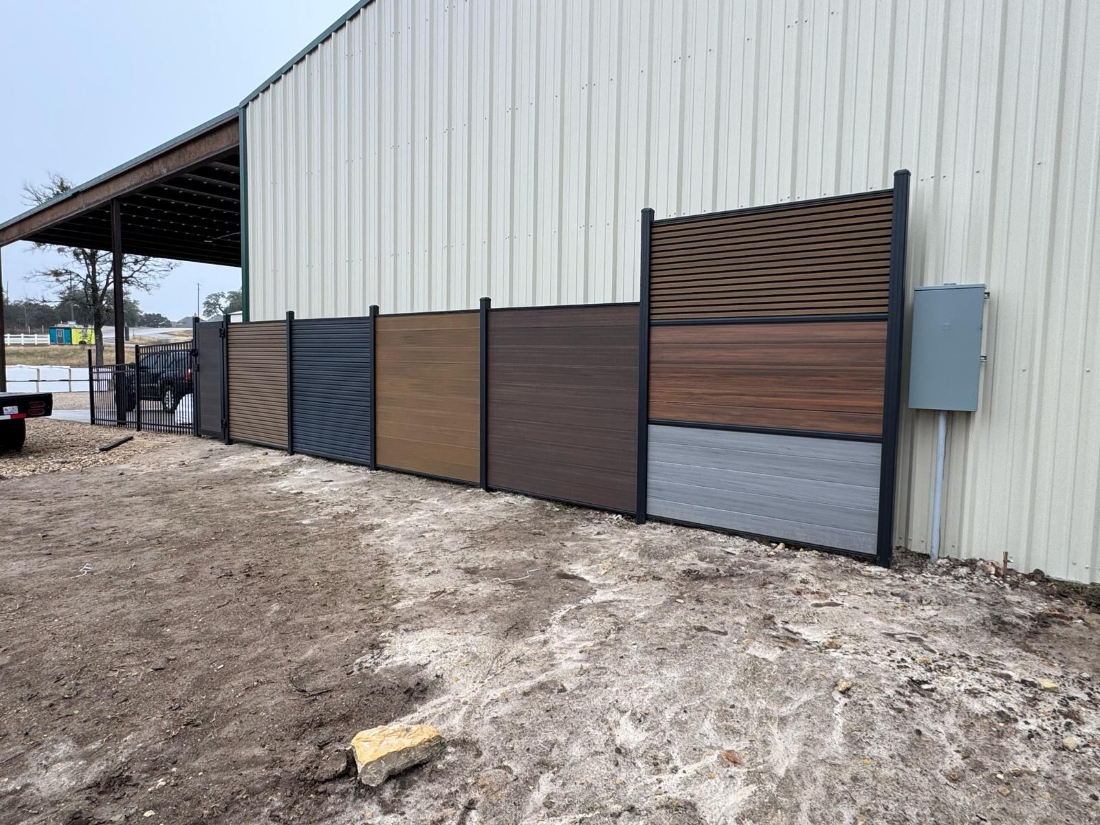 Multiple decorative fence panel styles and colors on display