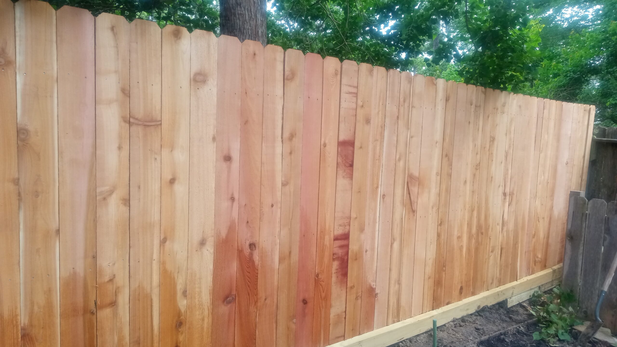 Wood privacy fence in a residential community setting