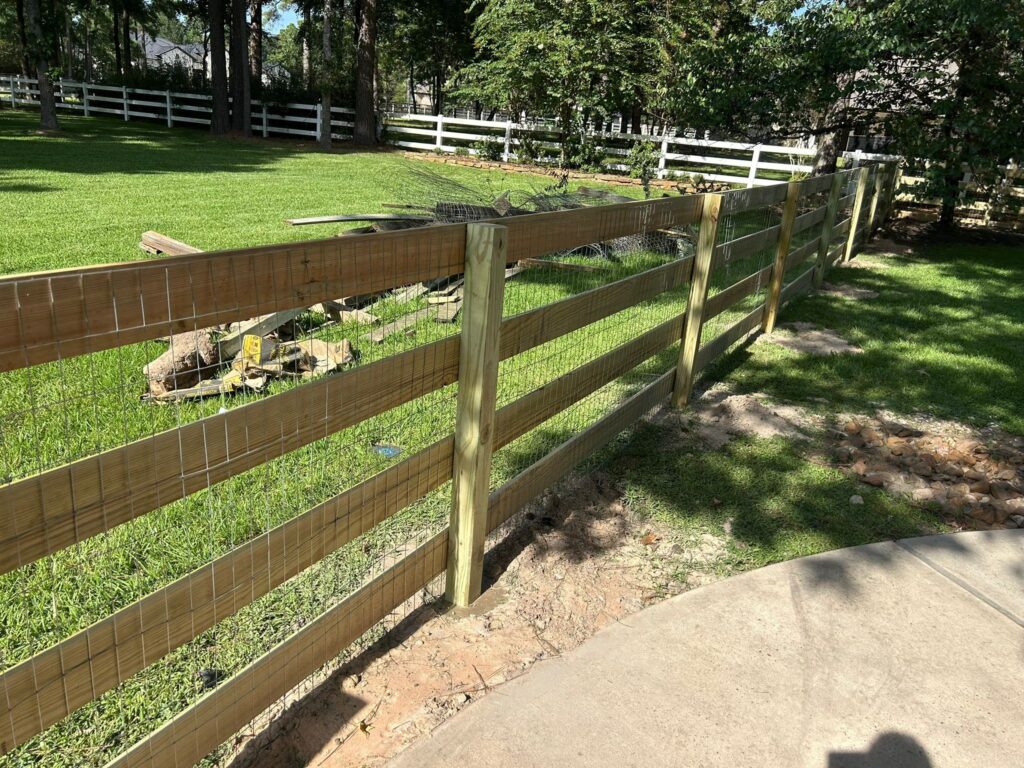 Ranch rail fencing along a rural livestock property