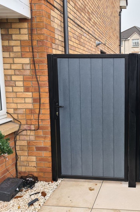 Tall composite side gate with reinforced frame