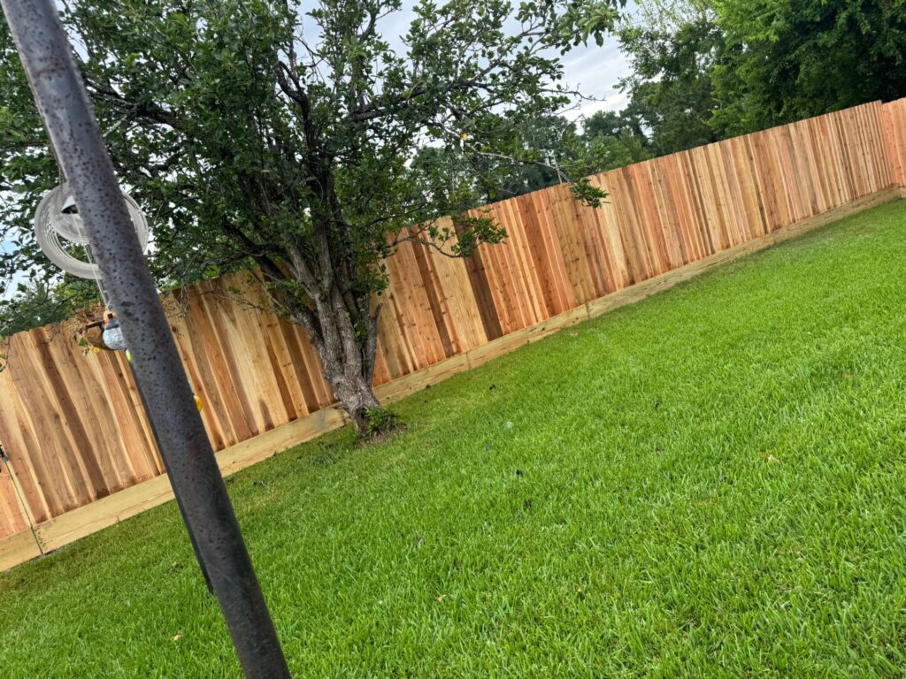 Cedar wood fence section along a side yard