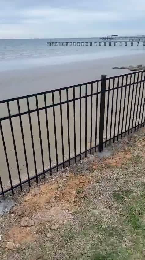 Black iron fence along the waterfront, Galveston County