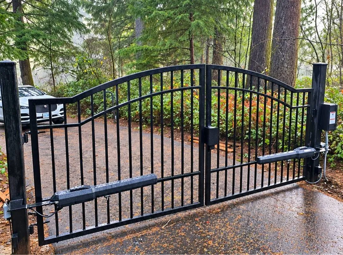 Arched iron double gate with swing operators