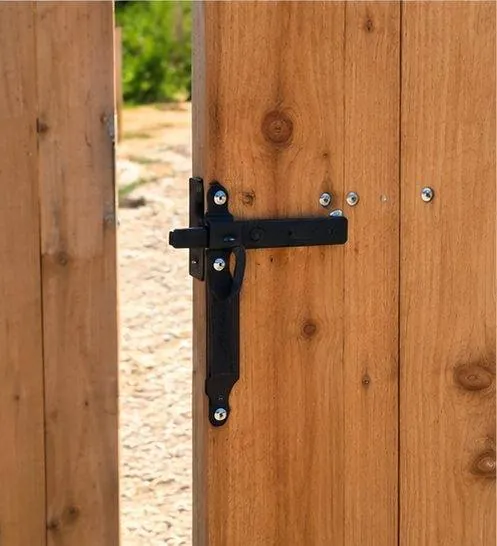 Black gate latch on cedar