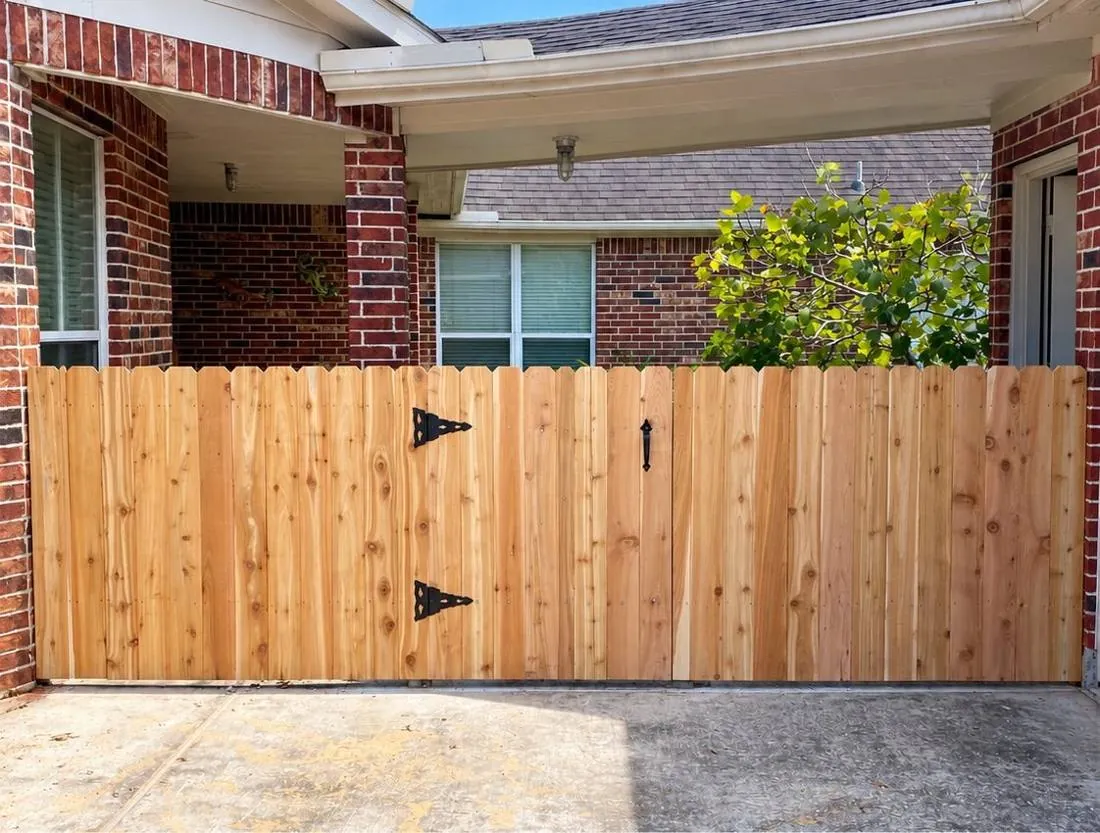 Cedar double gate at a brick home