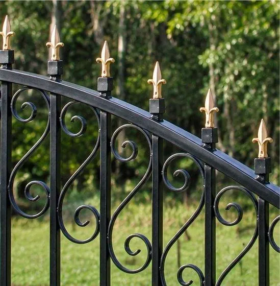 Gold-tipped finials on an arched iron gate