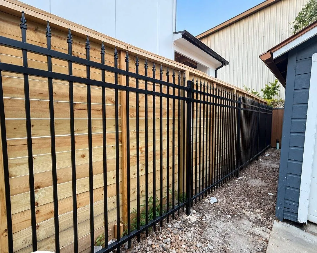 Long ornamental fence beside a building