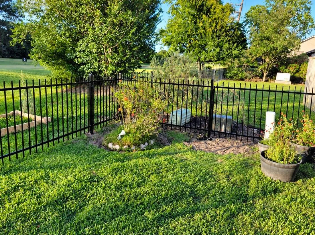 Ornamental gate at a lawn corner