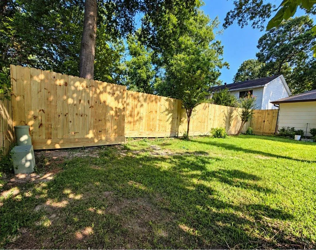 Pine privacy fence across a backyard