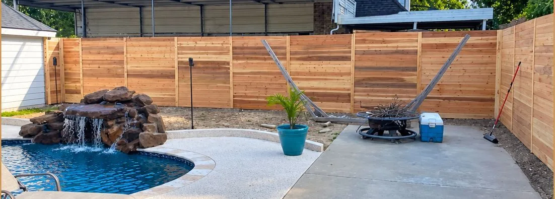 After: horizontal cedar privacy fence around a pool patio