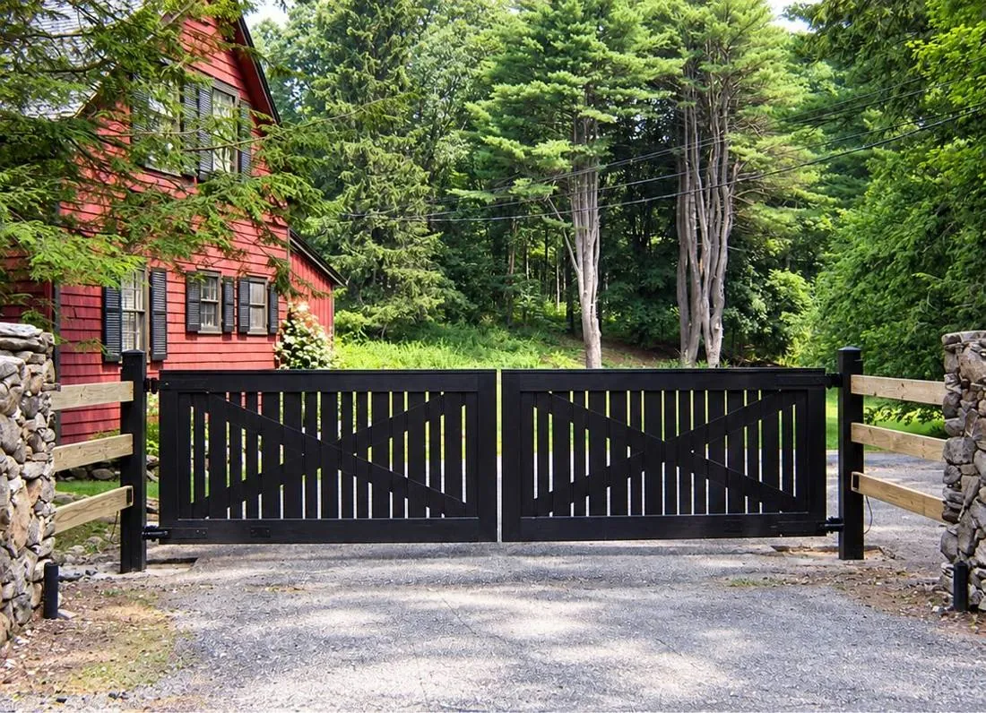 Ranch-style dark driveway gate