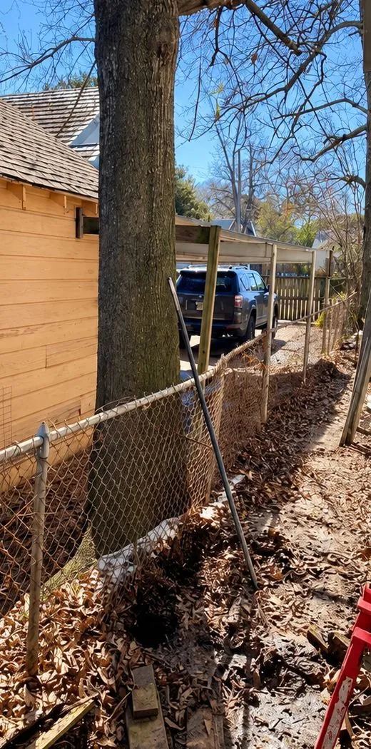 Before: old chain link and brush along the same side yard