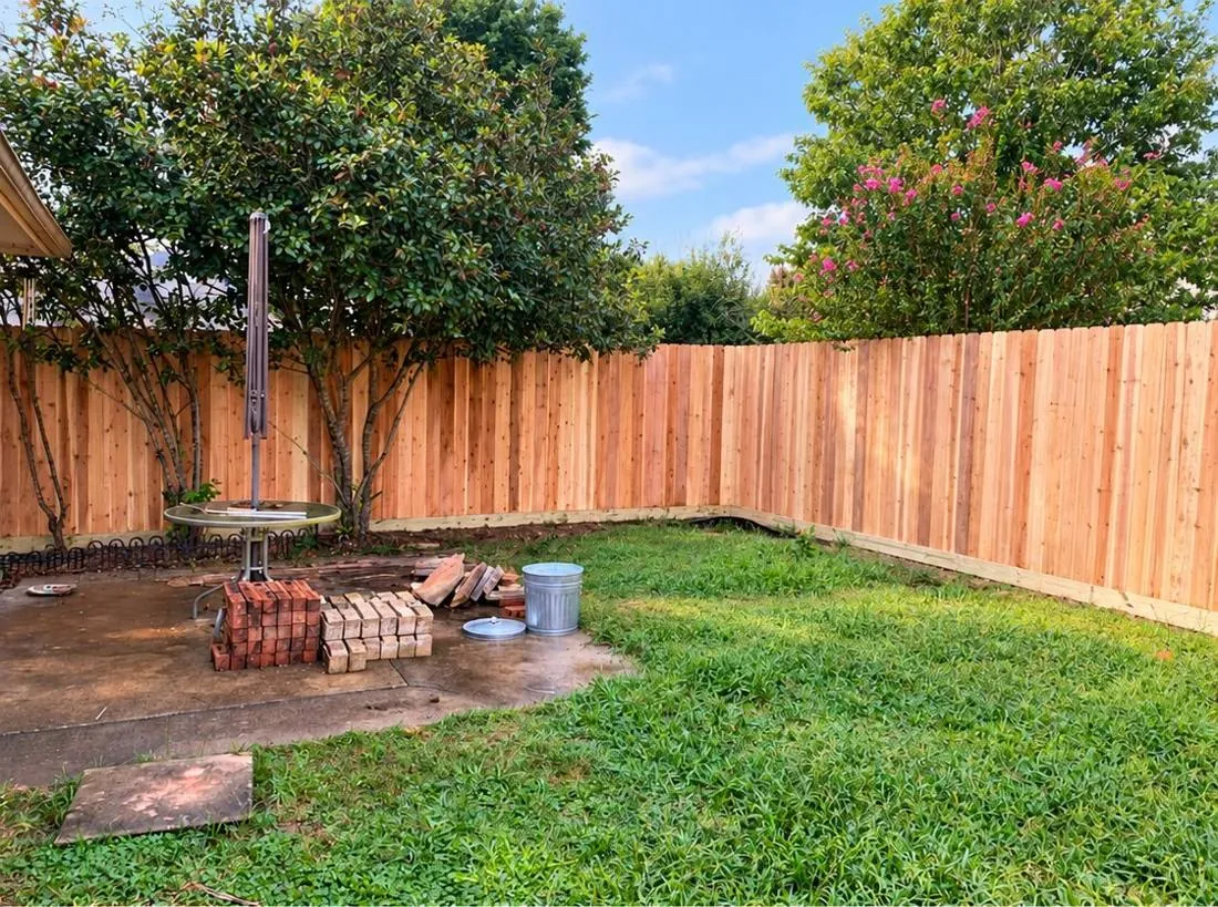 Wood privacy fence around a backyard